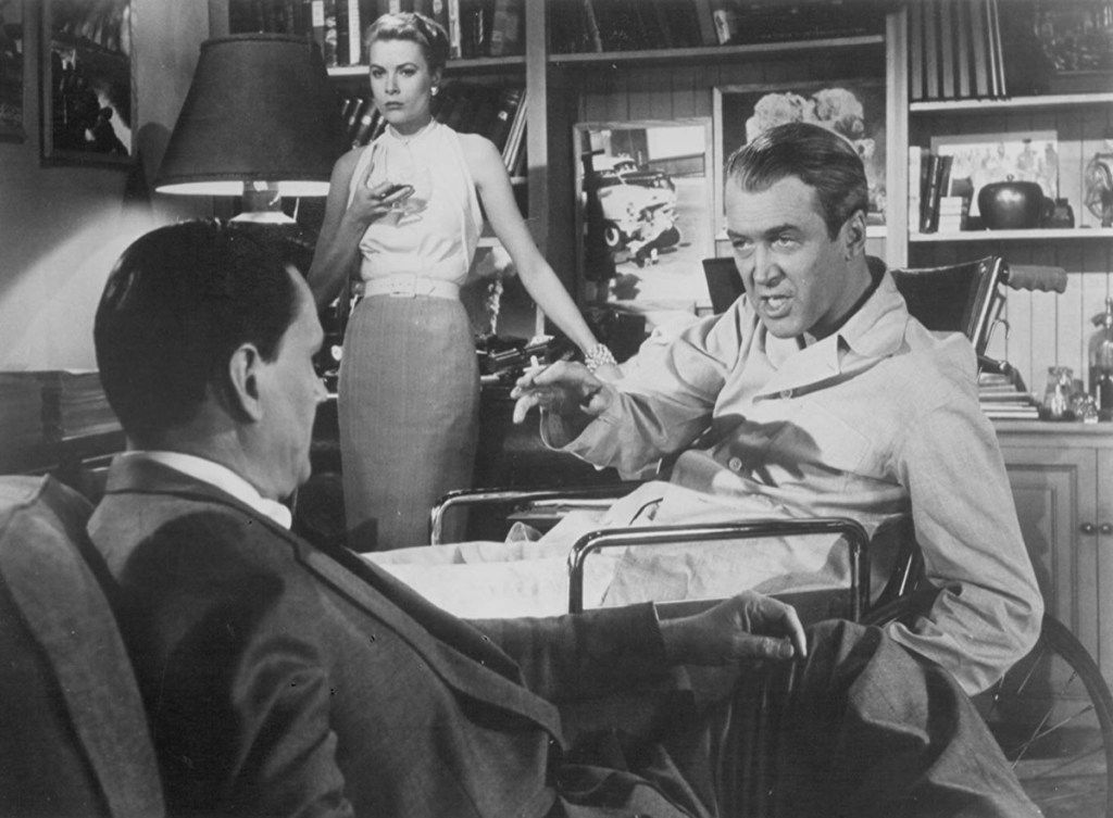 Grace Kelly, James Stewart ir Wendell Corey galiniame lange (1954)