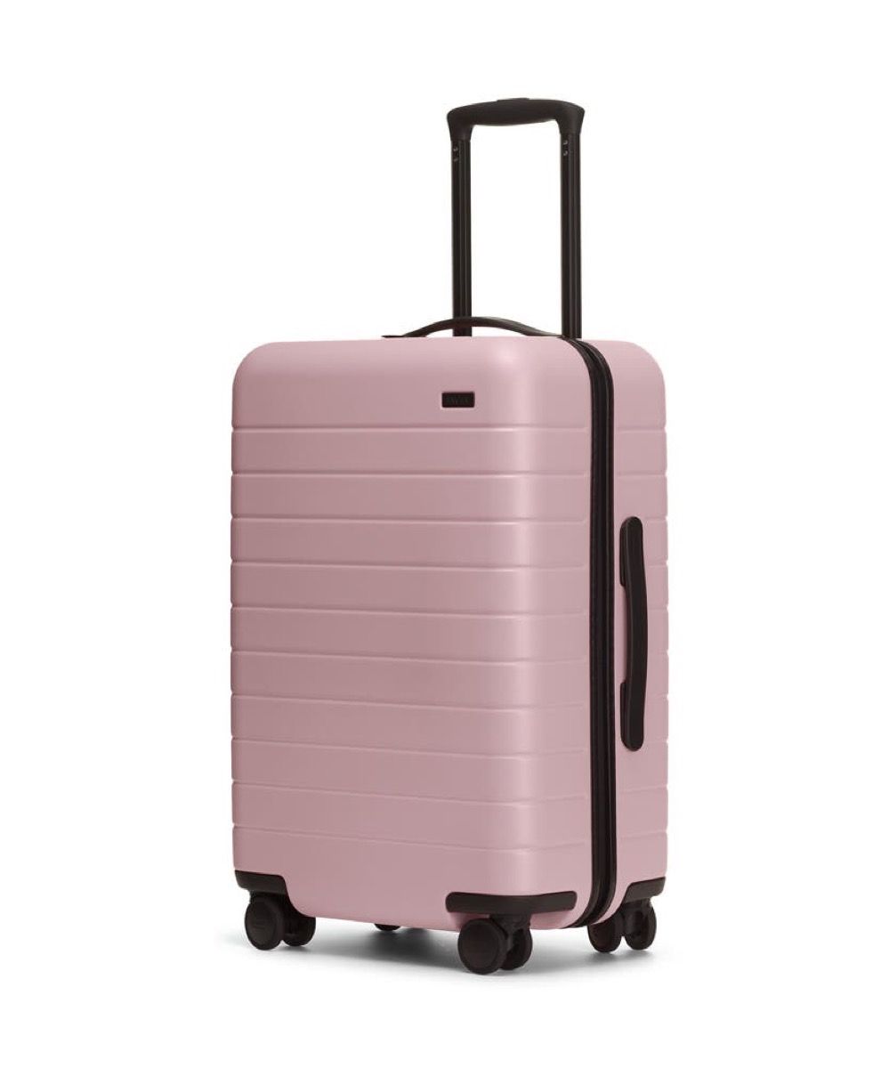 กระเป๋าเดินทางที่ยากลำบากสีชมพู